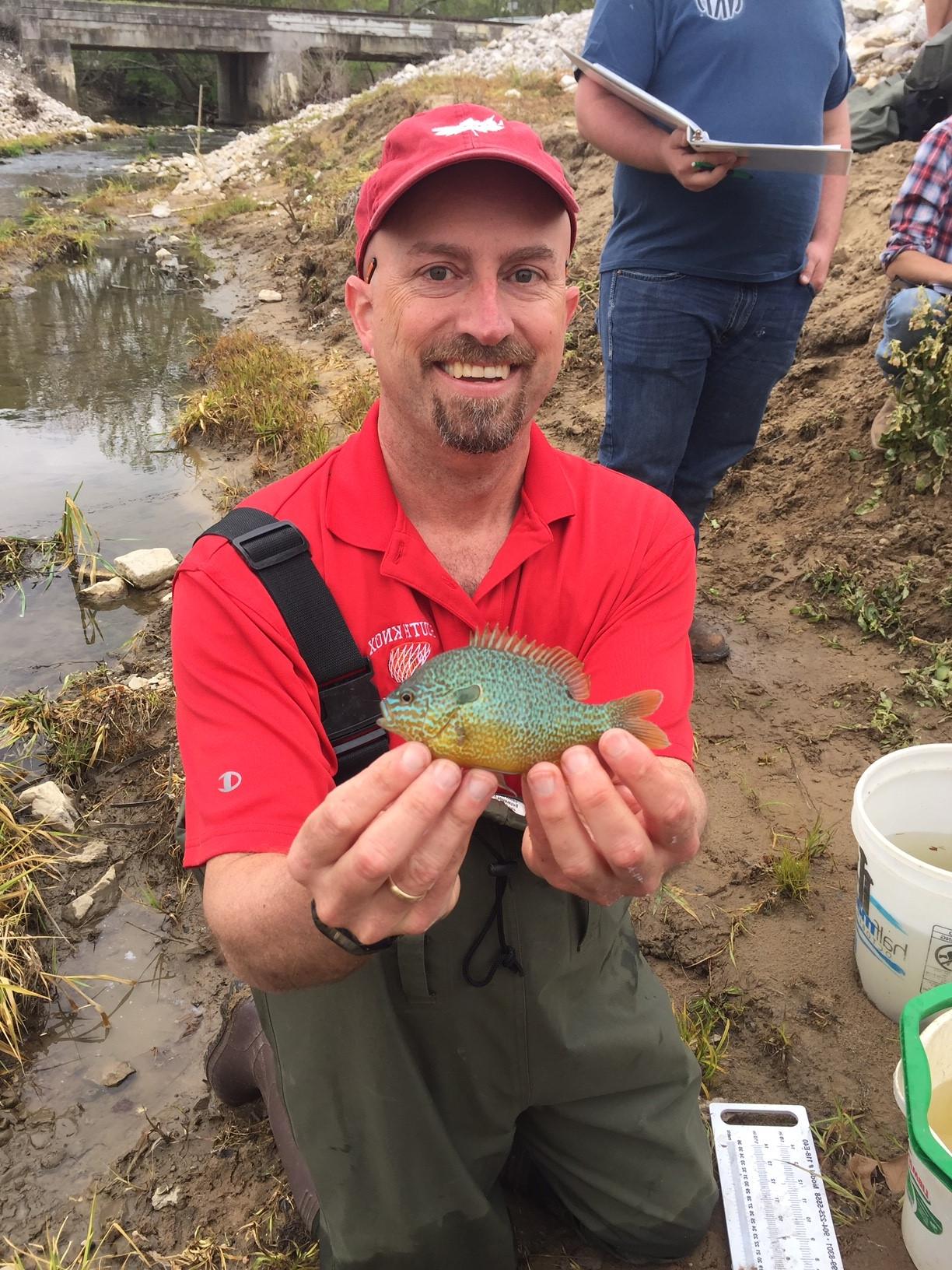 Curt Coffman holding a longear sunfish